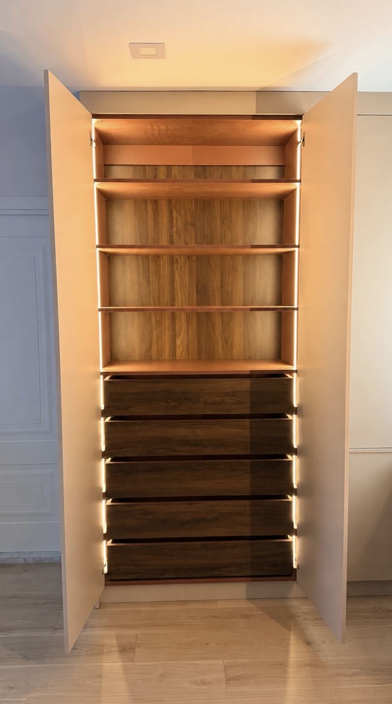 Tall closet with open shelving and dark wood drawers, LED lighting
