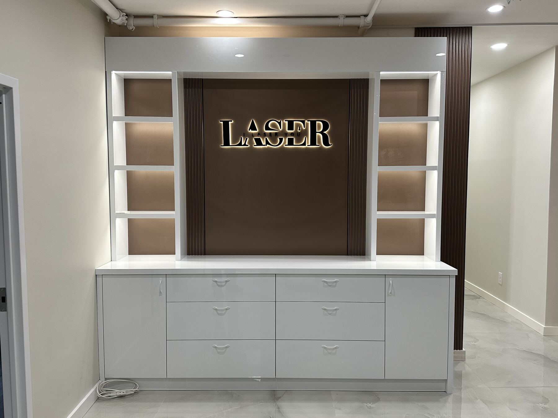 Backlit LASER reception cabinetry