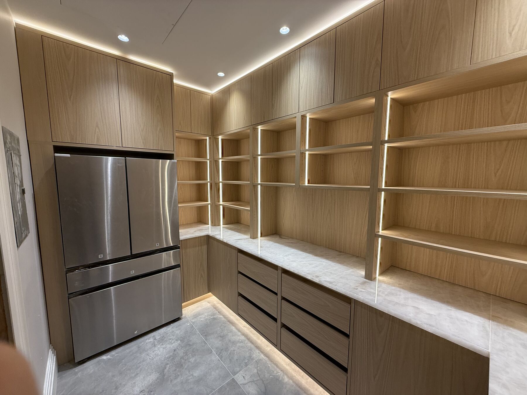 Pantry room cabinetry with built-in refrigerator